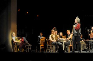Man of La Mancha: Lucy Schaufer (Aldonza), Andy Berry (Behind in Gray - Carrasco/Duke) and Robert Orth (Don Quixote/Cervantes) with the Ensemble. Photo by Kira Horvath.